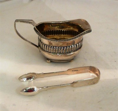 Lot 59 - Georgian silver jug and a pair of silver sugar tongs