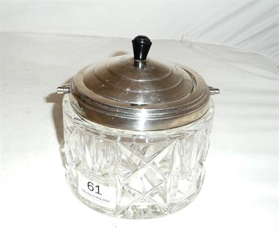 Lot 61 - A cut glass biscuit barrel with silver rim and cover (1935, Sheffield)