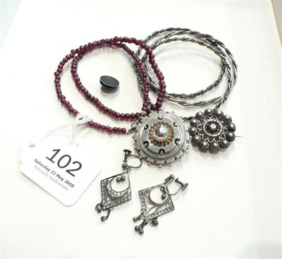 Lot 102 - A ruby necklace, two brooches, earrings, etc