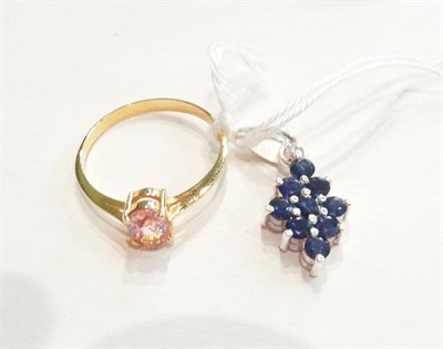 Lot 103 - A sapphire cluster pendant and a pink sapphire ring