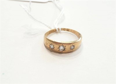 Lot 107 - An 18ct gold diamond three stone ring