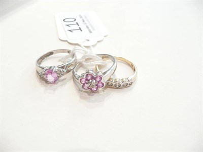 Lot 110 - A 9ct gold diamond five stone ring, a 9ct white gold diamond and pink sapphire cluster ring and...