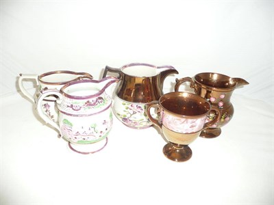 Lot 162 - Four lustre jugs and a goblet