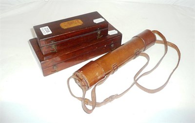 Lot 216 - Two cased hydrometers and a brass telescope