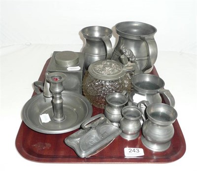 Lot 243 - A tray of pewter including gill measures, chamber stick etc