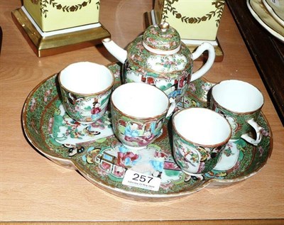 Lot 257 - A Canton enamelled porcelain 'tea' set of five pieces on tray (crack in teapot handle and crack...