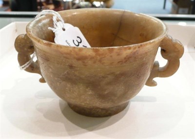 Lot 314 - A jade twin-handled cup, possibly 19th century