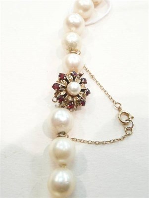 Lot 315 - A cultured baroque pearl necklet with a 9ct gold garnet and cultured pearl clasp