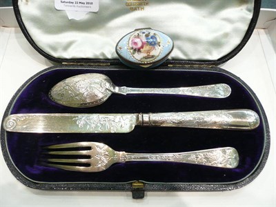 Lot 330 - Cased silver christening set and a Bilston enamel patch box