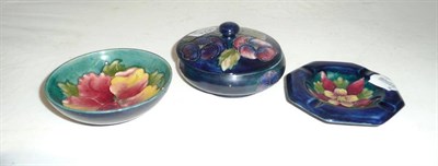 Lot 369 - A Walter Moorcroft "Pansy" circular box and cover, a Walter Moorcroft ashtray and bowl (a.f)