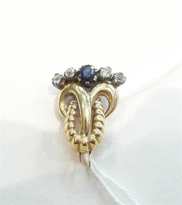 Lot 386 - A stylised ram's head sapphire and diamond pin