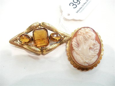 Lot 394 - A cameo brooch and a Victorian brooch