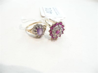 Lot 401 - An amethyst diamond cluster ring and a ruby diamond cluster ring (2)