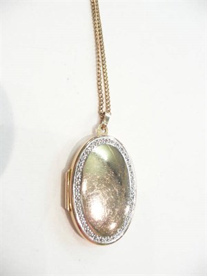 Lot 405 - A diamond set locket on chain