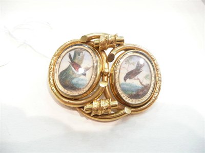 Lot 408 - A double locket brooch with bird depictions