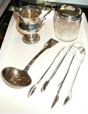 Lot 538 - A silver sauce ladle, two silver tongs, hair tidy and jug