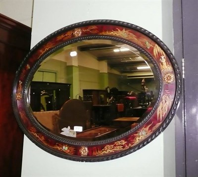 Lot 572 - Oval lacquered wall mirror