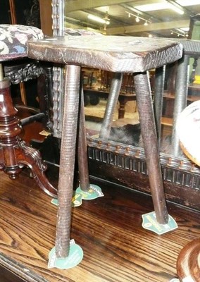 Lot 596 - A three legged stool