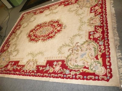 Lot 623 - Chinese red and cream ground woolen rug