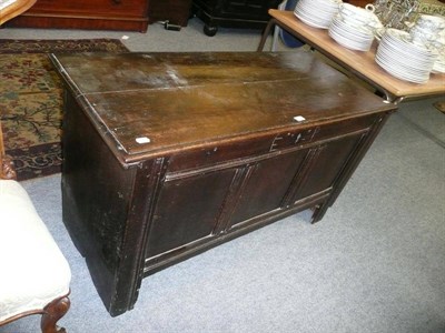 Lot 625 - An early 17th century oak coffer, hinged lid above panelled base on stiles, the frieze carved...