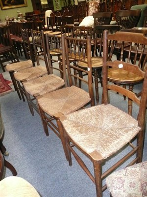 Lot 641 - Set of four rush-seated spindle-back chairs and a rush-seated ladder-back chair