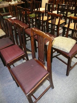 Lot 650 - A matched set of sixteen oak and mahogany dining chairs