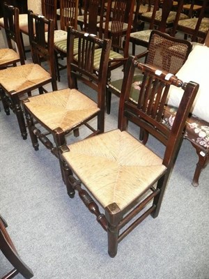 Lot 651 - Set of four rush-seated chairs