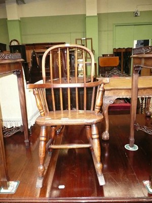 Lot 669 - 19th century child's elm rocking chair