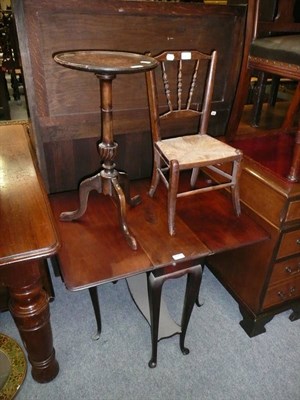 Lot 675 - An Edwardian mahogany drop leaf table with undertier, 20th century mahogany tripod table, an...