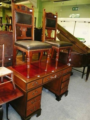 Lot 677 - Reproduction pedestal desk with leather top and two dining chairs