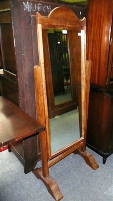 Lot 699 - An oak cheval mirror