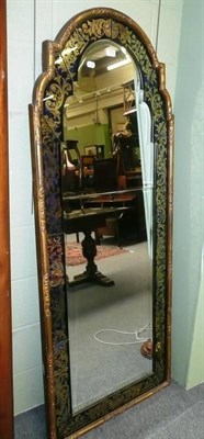 Lot 702 - A gilt glass and black framed wall mirror