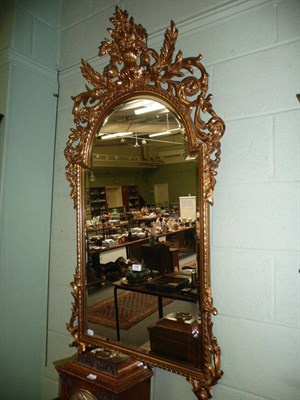 Lot 728 - A gilt mirror with foliate plume