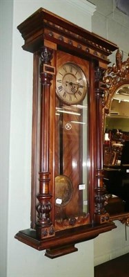 Lot 731 - A Vienna-type wall clock with two weights and pendulum