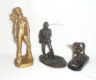 Lot 12 - A bronze group of a retriever with game bird, a resin model of a fisherman and a resin figure