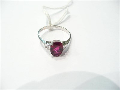 Lot 53 - An 18 carat white gold pink tourmaline and diamond dress ring