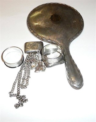 Lot 55 - Two silver vesta cases, a silver watch chain, two silver napkin rings, a silver backed dressing...