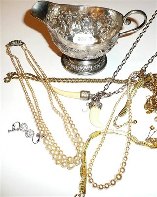 Lot 57 - Four gilt metal chains, two strands cultured pearls, a necklace, a bracelet, two pairs of earrings