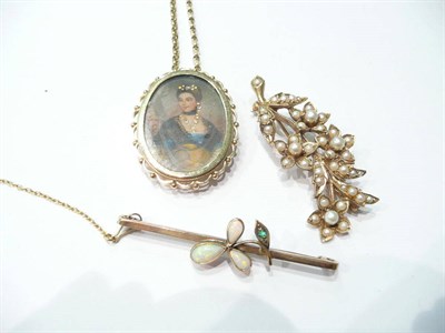 Lot 67 - A miniature in a 9ct gold brooch/pendant frame on chain, a 9ct gold seed pearl brooch and an...