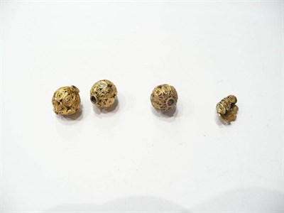 Lot 81 - Three filigree beads and a broken bead