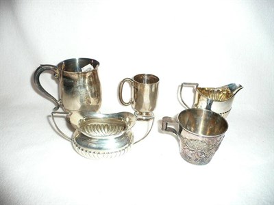 Lot 100 - Silver cream jug, silver sugar bowl, silver mug, small silver mug and a cup embossed with cattle in