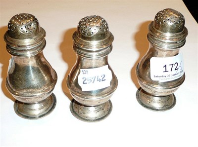 Lot 172 - A set of three silver pepperettes