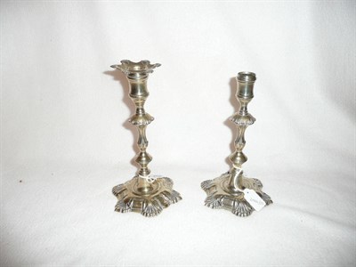 Lot 190 - A pair of Paktong table candlesticks, 18th century, each with concave sided nozzle, one retaining a