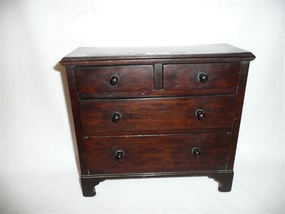 Lot 201 - A miniature mahogany chest of drawers