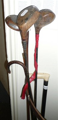 Lot 214 - Ivory handled cane, horse measuring stick, three golf clubs, three bowling balls, and another cane