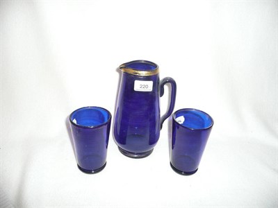 Lot 220 - Bristol blue glass decanter and two glasses