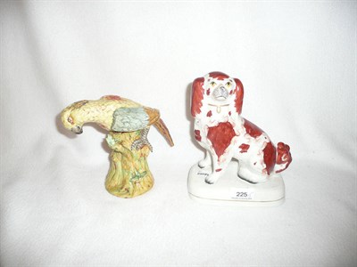 Lot 225 - Staffordshire pottery parrot and spaniel