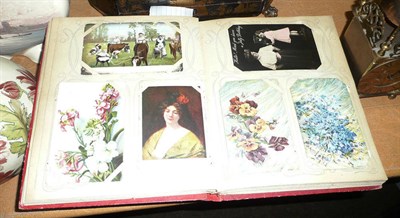 Lot 243 - An album containing approximately 200 pre-war postcards