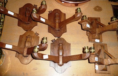 Lot 249 - Four Bob "Wrenman" Hunter twin branch wall lights and a pair of Colin "Beaverman" Almack twin...