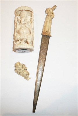 Lot 265 - Japanese ivory netsuke of a wolf, Japanese ivory paper knife and an Indian ivory elephant god